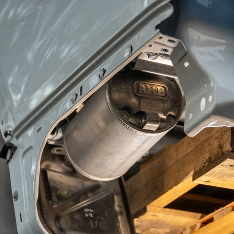 ARB 4L air tank under-tub mount showing the tank band mounting face