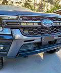 Behind the grille light bar bracket showing the light bar mounting positions