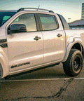 VIKOR electric side step extending on a white Ford Ranger Wildtrak