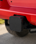 Black tow receiver cover fitted to the 50mm hitch on a red Next Gen Ford Ranger